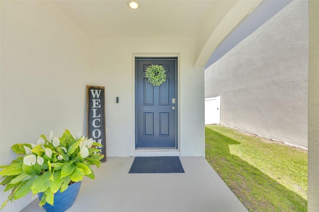 doorway to property with stucco siding