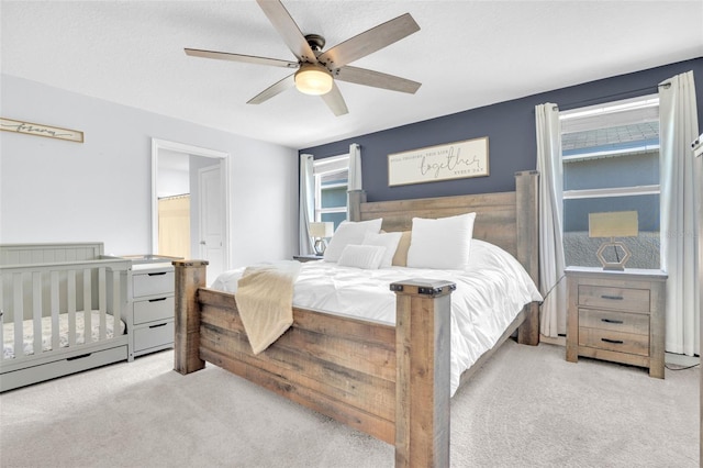 bedroom with a ceiling fan and carpet floors