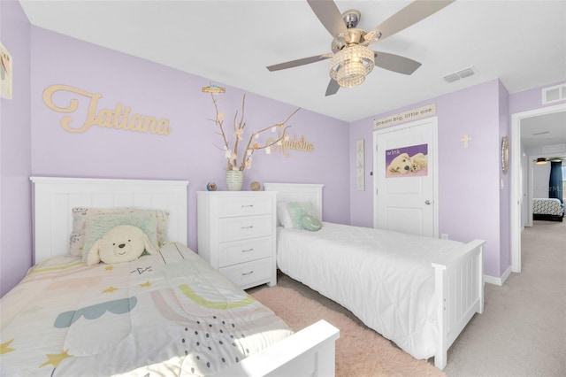 bedroom with light carpet, baseboards, visible vents, and ceiling fan