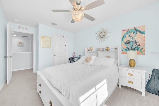 bedroom with light colored carpet, ceiling fan, baseboards, and visible vents