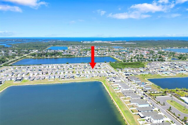 aerial view with a residential view and a water view