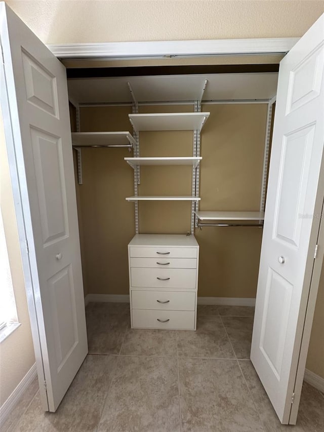 4235 Angelica Loop, Wesley Chapel, FL 33543 - walk in closet featuring light tile patterned floors