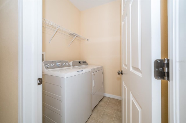 4235 Angelica Loop, Wesley Chapel, FL 33543 - laundry area with separate washer and dryer, light tile patterned floors, and baseboards
