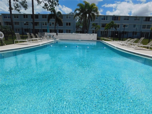 4715 Bay St NE Unit 119, Saint Petersburg, FL 33703 - community pool featuring a patio area and fence