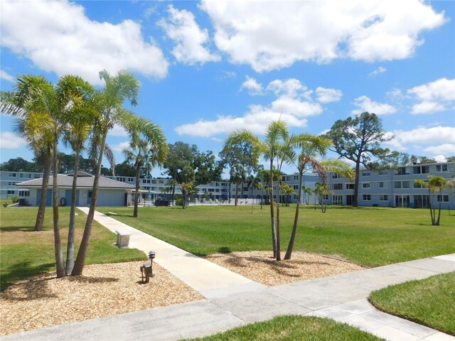 4715 Bay St NE Unit 119, Saint Petersburg, FL 33703 - view of community with a yard and a residential view