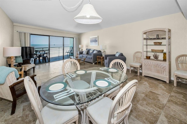 dining area featuring stone tile flooring