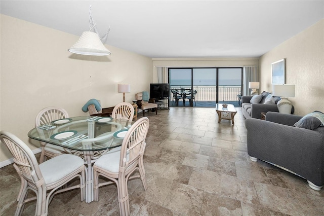 dining area featuring stone tile flooring