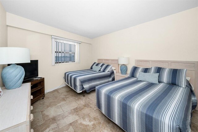 bedroom with stone finish floor