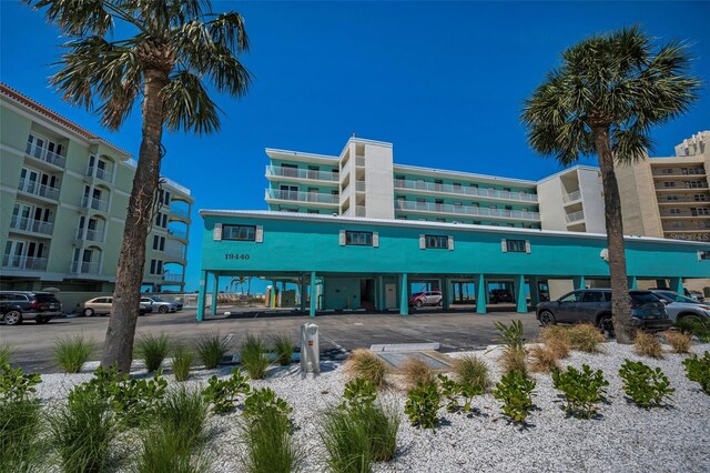 view of property with uncovered parking