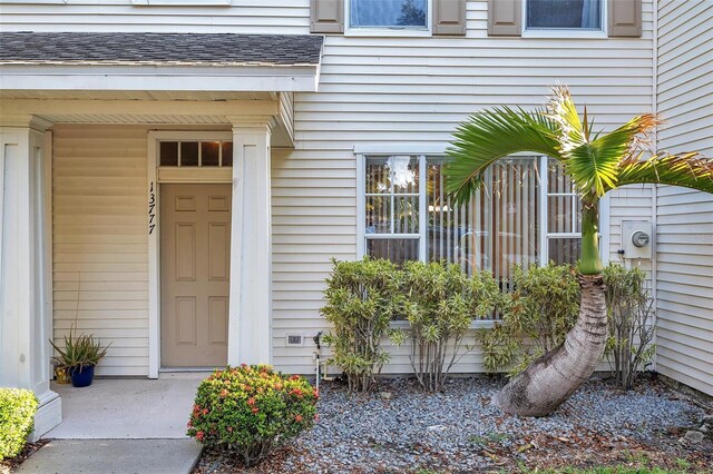 13777 Forest Lake Dr, Largo, FL 33771 - property entrance featuring roof with shingles