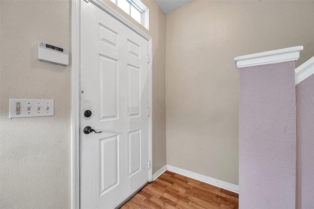 13777 Forest Lake Dr, Largo, FL 33771 - entryway featuring baseboards and light wood-style floors