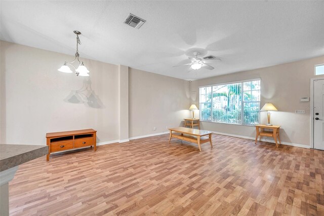 13777 Forest Lake Dr, Largo, FL 33771 - sitting room with baseboards, light wood-style flooring, visible vents, and ceiling fan