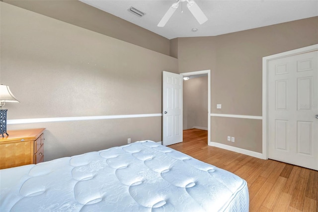 13777 Forest Lake Dr, Largo, FL 33771 - bedroom with wood finished floors, visible vents, a ceiling fan, and baseboards