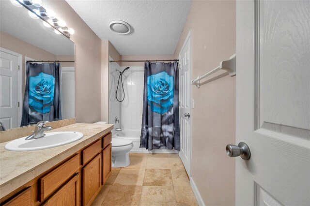 13777 Forest Lake Dr, Largo, FL 33771 - bathroom with toilet, vanity, baseboards, a textured ceiling, and shower / bath combo