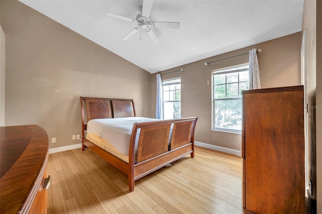 13777 Forest Lake Dr, Largo, FL 33771 - bedroom with vaulted ceiling, light wood-style flooring, and baseboards