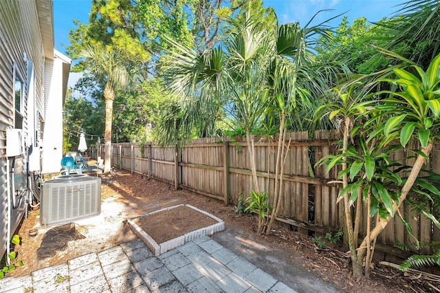 13777 Forest Lake Dr, Largo, FL 33771 - view of patio / terrace featuring a fenced backyard and central air condition unit