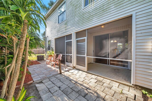13777 Forest Lake Dr, Largo, FL 33771 - view of patio / terrace featuring fence and central AC unit