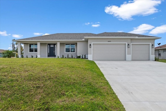 10493 Grail Ave, Englewood, FL 34224 - view of front of property featuring a garage, stucco siding, a front lawn, a shingled roof, and concrete driveway