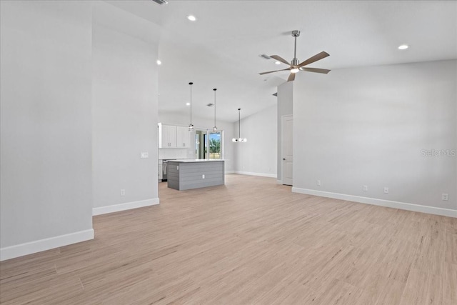 10493 Grail Ave, Englewood, FL 34224 - unfurnished living room with light wood-type flooring, ceiling fan, and baseboards