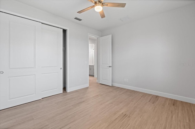 10493 Grail Ave, Englewood, FL 34224 - unfurnished bedroom with ceiling fan, light wood-style flooring, a closet, visible vents, and baseboards