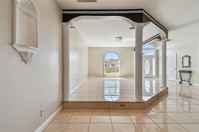 284 Peninsula Ave, Tarpon Springs, FL 34689 - tiled entryway with ornate columns, baseboards, and arched walkways