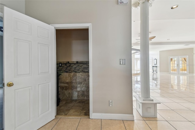 284 Peninsula Ave, Tarpon Springs, FL 34689 - hallway featuring light tile patterned floors, baseboards, recessed lighting, and tile walls