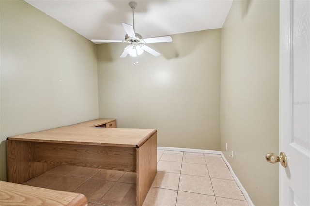284 Peninsula Ave, Tarpon Springs, FL 34689 - dining room with light tile patterned floors, a ceiling fan, and baseboards