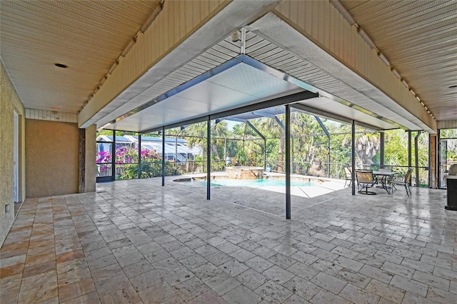284 Peninsula Ave, Tarpon Springs, FL 34689 - view of patio / terrace with a pool with connected hot tub and glass enclosure