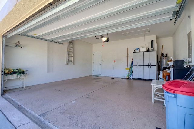 1023 Orca Ct, Holiday, FL 34691 - garage with water heater and a garage door opener