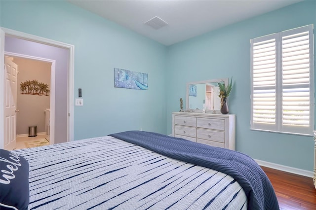 1023 Orca Ct, Holiday, FL 34691 - bedroom with baseboards and wood finished floors