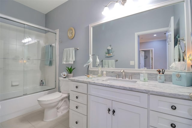 1023 Orca Ct, Holiday, FL 34691 - full bathroom featuring tile patterned floors, vanity, enclosed tub / shower combo, and toilet