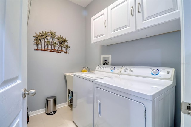 1023 Orca Ct, Holiday, FL 34691 - clothes washing area featuring baseboards, cabinet space, tile patterned flooring, and independent washer and dryer