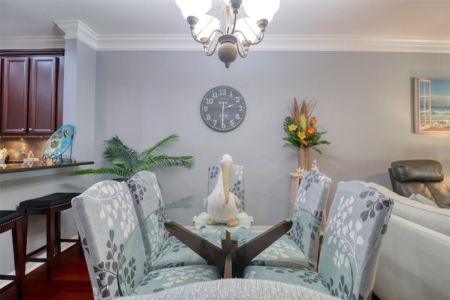 1023 Orca Ct, Holiday, FL 34691 - dining space with wood finished floors, an inviting chandelier, and crown molding
