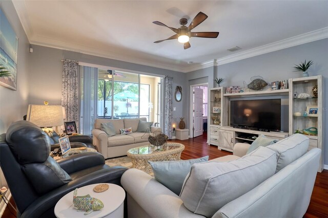 1023 Orca Ct, Holiday, FL 34691 - living room featuring dark wood finished floors, ornamental molding, a ceiling fan, and visible vents