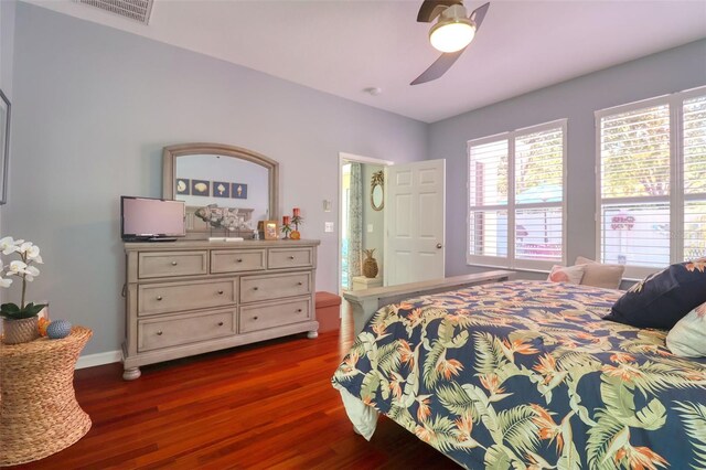 1023 Orca Ct, Holiday, FL 34691 - bedroom featuring ceiling fan, baseboards, visible vents, and dark wood-style floors
