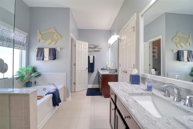 1023 Orca Ct, Holiday, FL 34691 - full bathroom with a bath, tile patterned floors, a sink, and two vanities