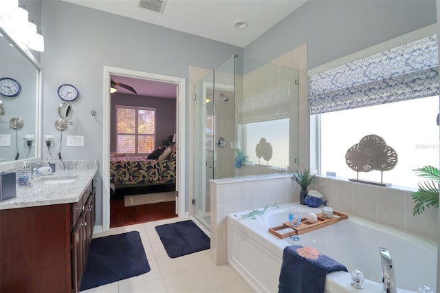 1023 Orca Ct, Holiday, FL 34691 - bathroom featuring tile patterned flooring, visible vents, a bath, a stall shower, and ensuite bathroom