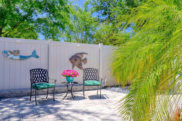 1023 Orca Ct, Holiday, FL 34691 - view of patio / terrace featuring a fenced backyard