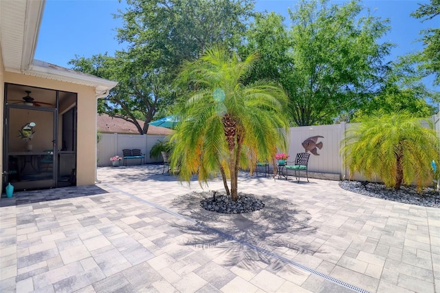 1023 Orca Ct, Holiday, FL 34691 - view of patio / terrace with a fenced backyard and ceiling fan