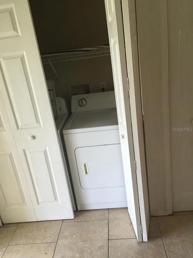 244 Countryside Key Blvd, Oldsmar, FL 34677 - laundry room featuring light tile patterned floors and hookup for a washing machine