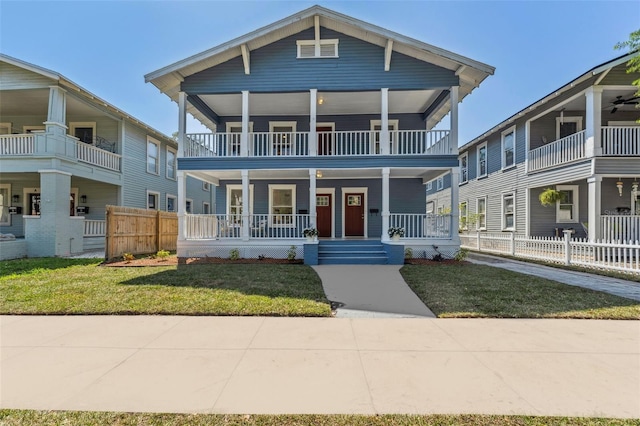 307 S Newport Ave, Tampa, FL 33606 - view of front of home with a front lawn, fence, and covered porch