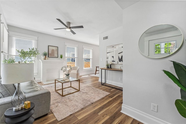 307 S Newport Ave, Tampa, FL 33606 - living area featuring baseboards, a wealth of natural light, visible vents, ceiling fan, and wood finished floors