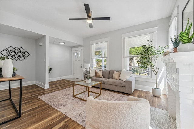 307 S Newport Ave, Tampa, FL 33606 - living room with a ceiling fan, baseboards, and dark wood-style floors