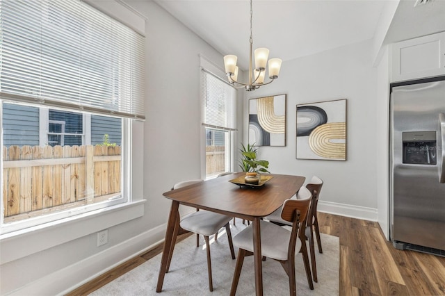 307 S Newport Ave, Tampa, FL 33606 - dining room with a chandelier, baseboards, and dark wood finished floors