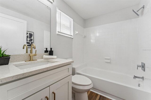 307 S Newport Ave, Tampa, FL 33606 - full bathroom featuring toilet, wood finished floors, tub / shower combination, and vanity