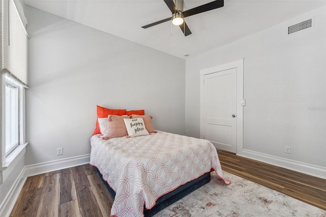 307 S Newport Ave, Tampa, FL 33606 - bedroom with visible vents, multiple windows, baseboards, and wood finished floors