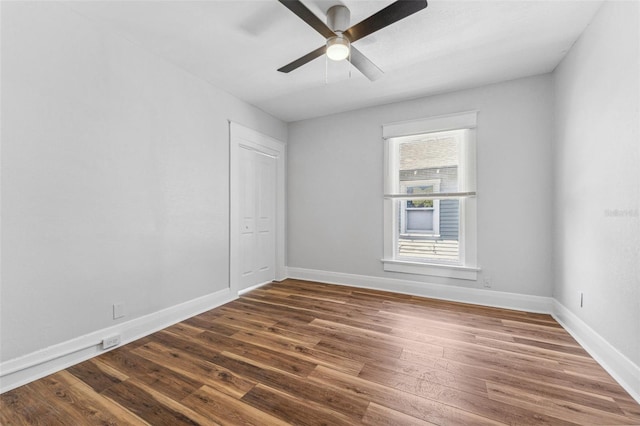 307 S Newport Ave, Tampa, FL 33606 - unfurnished room with ceiling fan, baseboards, and dark wood-style floors