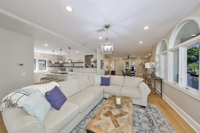 2802 Old Bayshore Way, Tampa, FL 33611 - living room featuring light wood finished floors, recessed lighting, baseboards, and ceiling fan