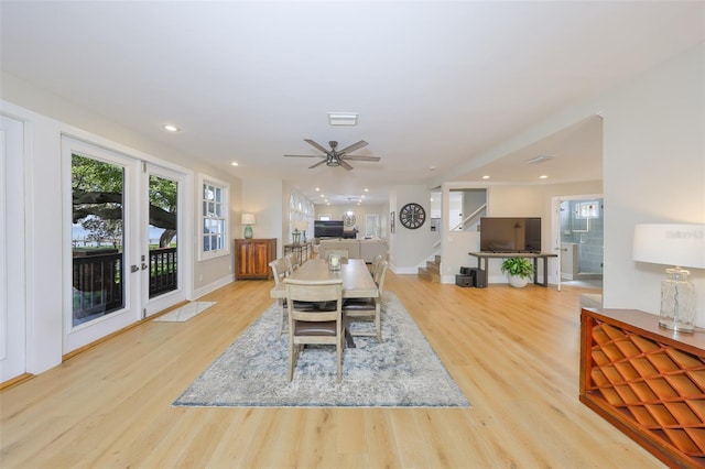 2802 Old Bayshore Way, Tampa, FL 33611 - dining area with light wood-type flooring, stairway, baseboards, ceiling fan, and recessed lighting