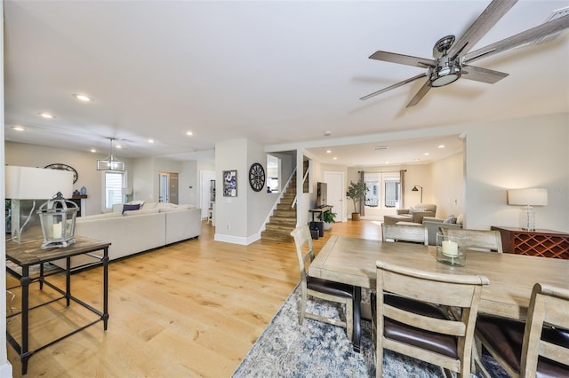 2802 Old Bayshore Way, Tampa, FL 33611 - dining space featuring stairs, light wood-style flooring, ceiling fan, recessed lighting, and baseboards